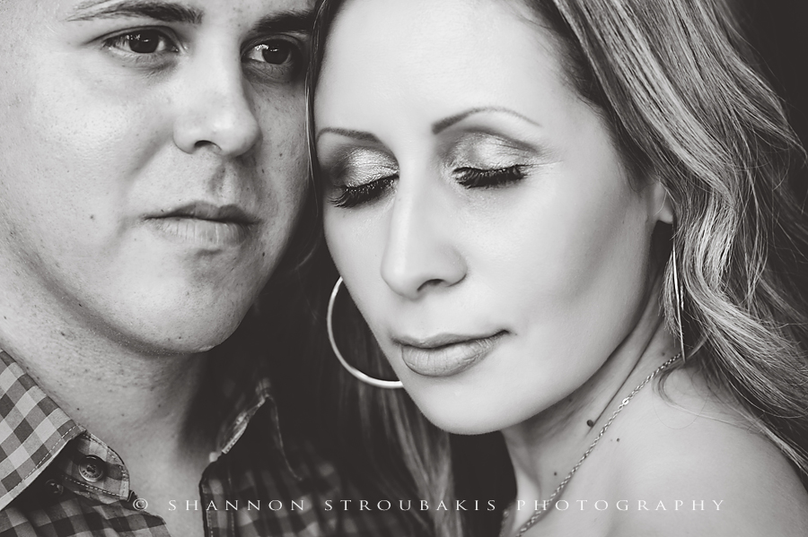 black and white engagement portraits with eye closed