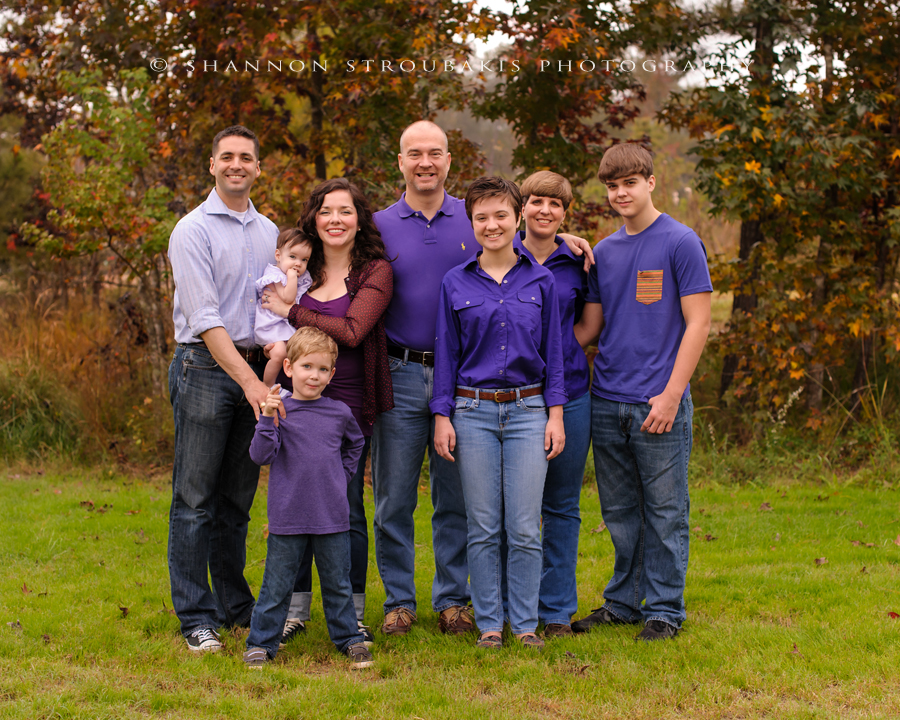 large family with children and adults in the woodlands for family photography