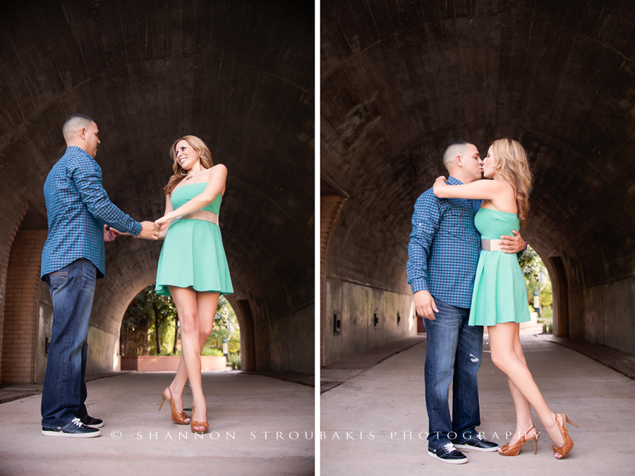 engagement photography in the woodlands with a couple dancing and kissing