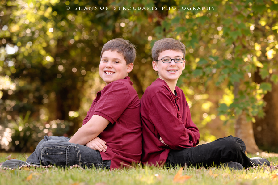 fun family portraits in the woodlands of siblings and brothers