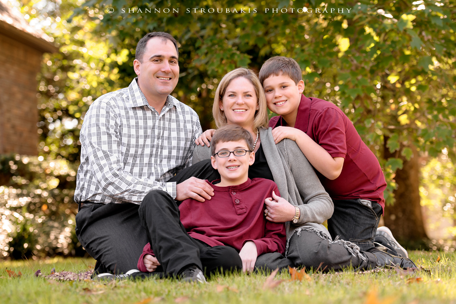 classic and traditional family pose for a family in the woodlands