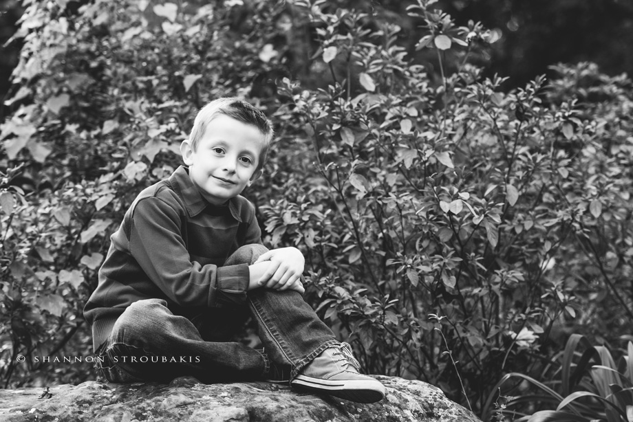 black and white portrait of children in the woodlands park