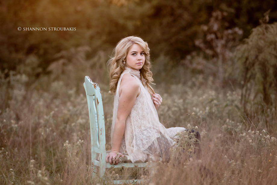 chair in field senior pictures the woodlands